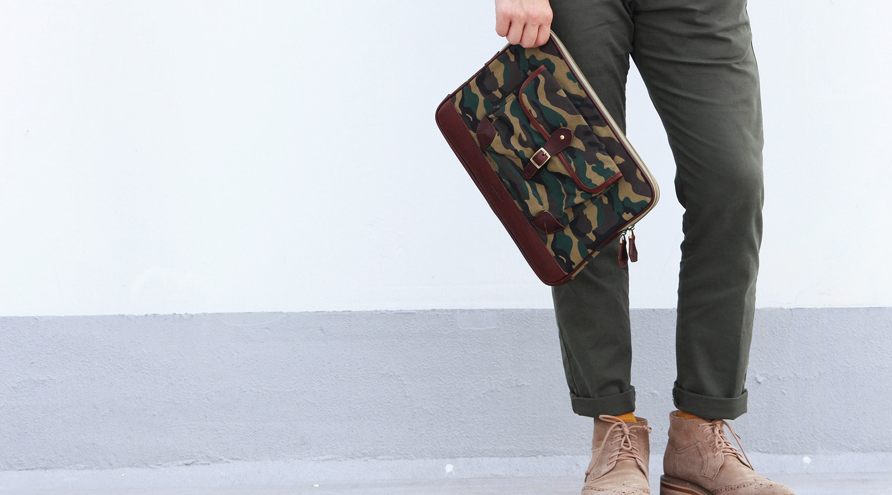 Our brown full-grain leather Alden Folio with Camouflage canvas delivers a fashion forward option to carrying documents around. Able to fit a 13” laptop comfortably and crafted with an easy access outer compartment, the Alden is a stylish piece for everyd
